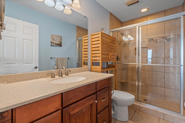 310 Kleinshore Rd Unit C9, Hot Springs, AR 71913 - full bathroom featuring vanity, a shower stall, tile patterned floors, and a textured ceiling