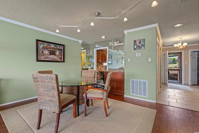 310 Kleinshore Rd Unit C9, Hot Springs, AR 71913 - dining area featuring crown molding, a chandelier, and wood finished floors