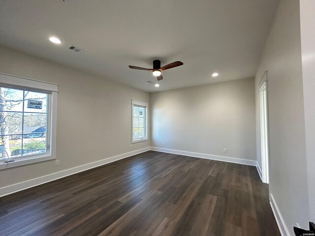 spare room with visible vents, baseboards, dark wood finished floors, ceiling fan, and recessed lighting