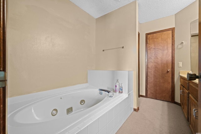 203 Stearns Pt Unit E1, Hot Springs, AR 71913 - bathroom featuring vanity, a tub with jets, baseboards, tile patterned floors, and a textured ceiling