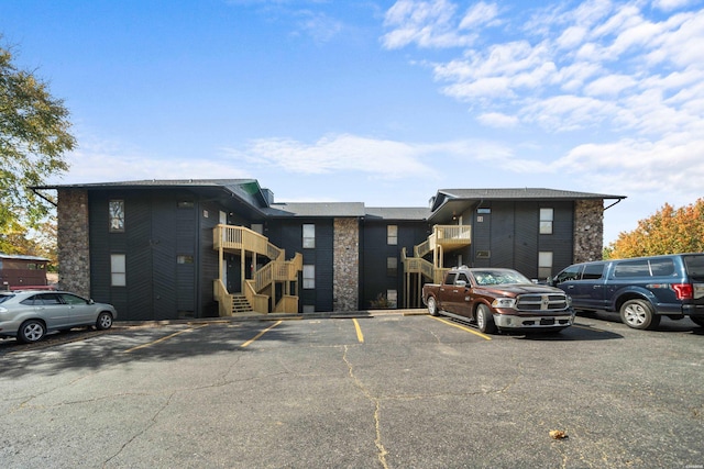 203 Stearns Pt Unit E1, Hot Springs, AR 71913 - view of building exterior featuring uncovered parking and stairway