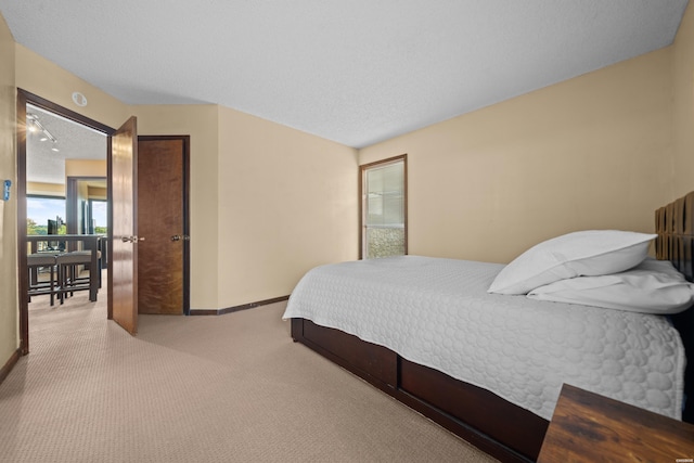 203 Stearns Pt Unit E1, Hot Springs, AR 71913 - bedroom featuring carpet floors, baseboards, and a textured ceiling