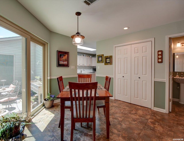 dining area featuring baseboards, recessed lighting, and visible vents