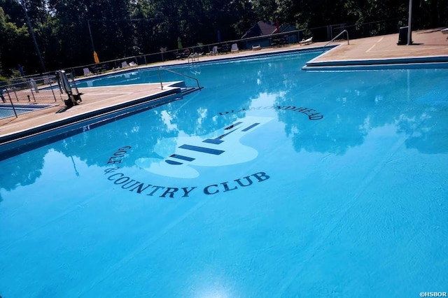 community pool featuring fence