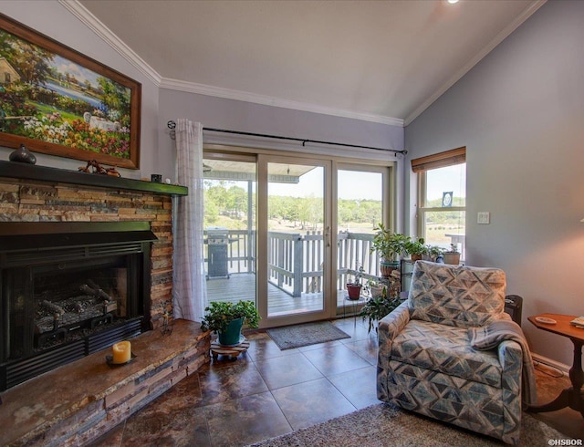 interior space with plenty of natural light, ornamental molding, a stone fireplace, and lofted ceiling