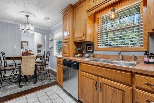 kitchen with brown cabinetry, dishwasher, hanging light fixtures, and a sink