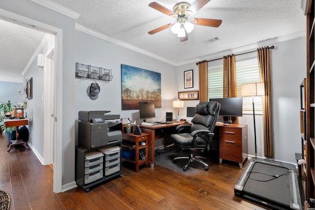 office space featuring dark wood-style floors, visible vents, ornamental molding, ceiling fan, and a textured ceiling