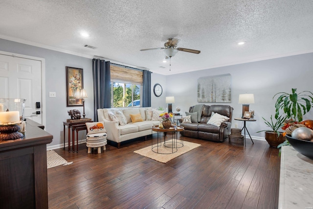 living room featuring ornamental molding, dark wood finished floors, a textured ceiling, and baseboards