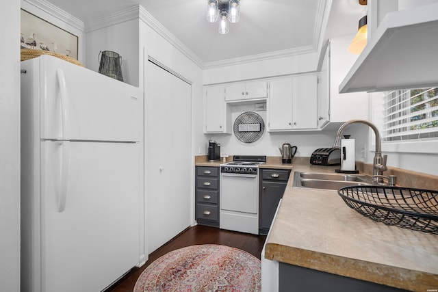 kitchen featuring light countertops, white appliances, white cabinets, and crown molding