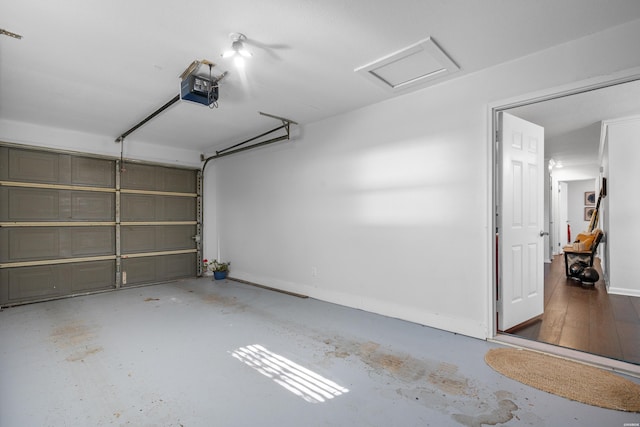 garage featuring baseboards and a garage door opener