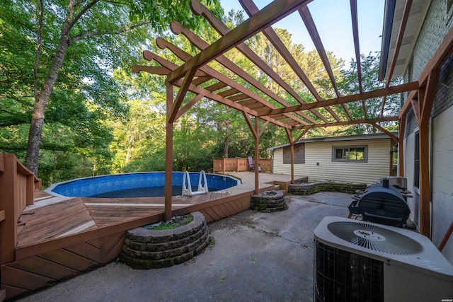 view of patio featuring cooling unit, a pergola, and an outdoor pool
