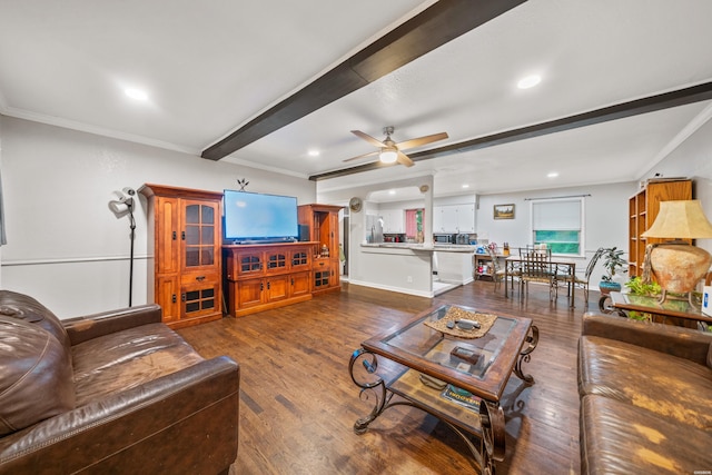 living area with a ceiling fan, dark wood-style floors, beam ceiling, ornamental molding, and recessed lighting