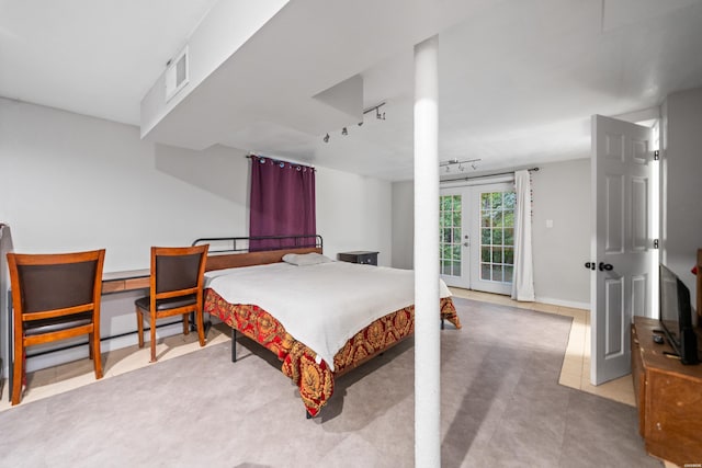 bedroom featuring french doors and access to exterior