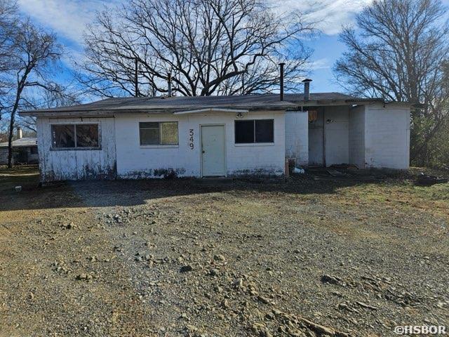 view of front of home featuring concrete block siding