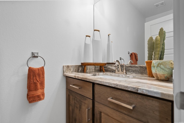 bathroom featuring visible vents and vanity