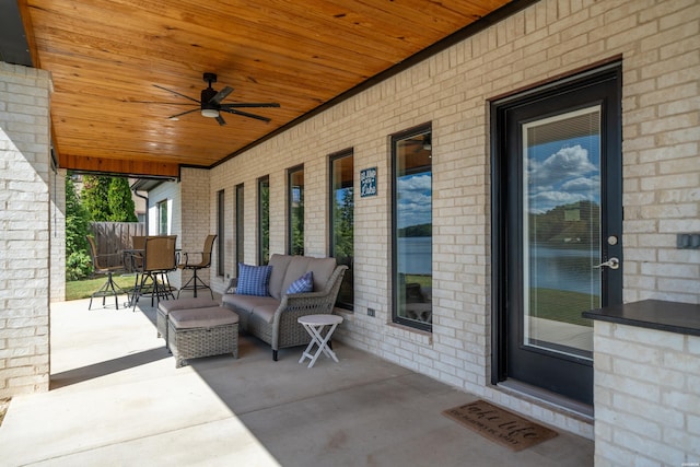 view of patio / terrace featuring outdoor lounge area, fence, a ceiling fan, and visible vents