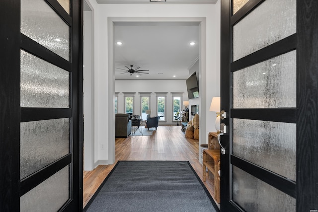 foyer with recessed lighting, baseboards, wood finished floors, and a ceiling fan