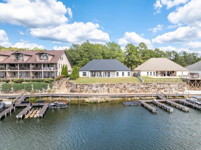 dock area featuring a yard and a water view