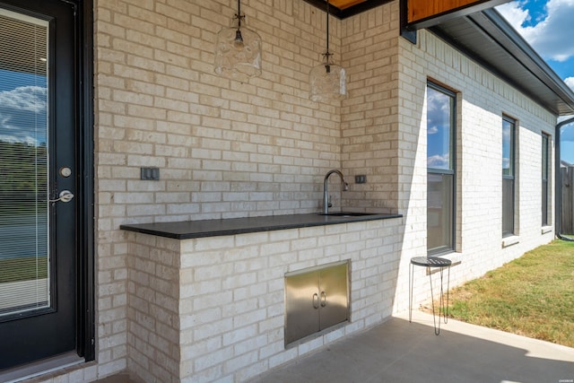 view of patio / terrace featuring a sink