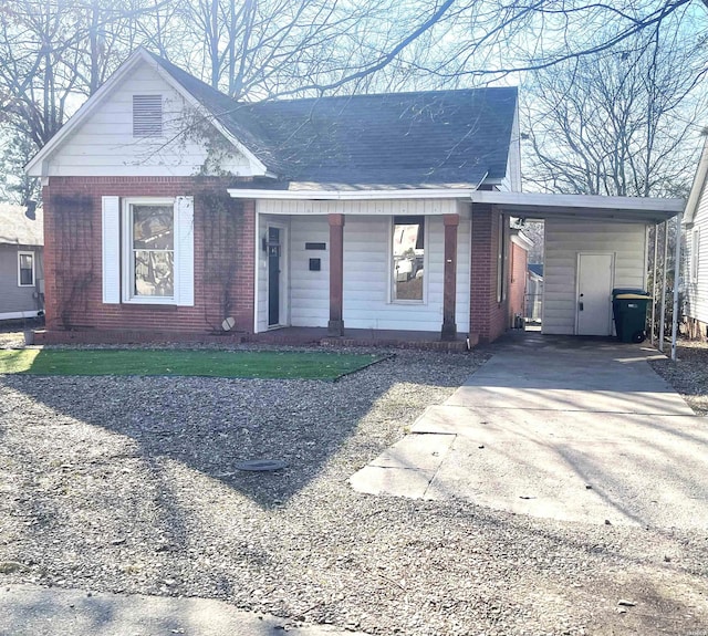 view of front of house with brick siding and driveway