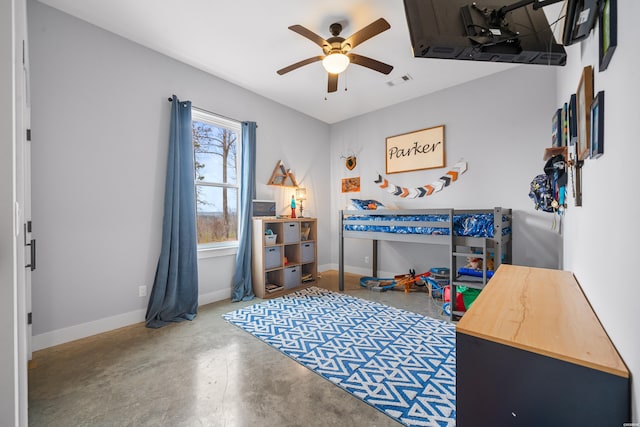 bedroom with concrete flooring, visible vents, ceiling fan, and baseboards