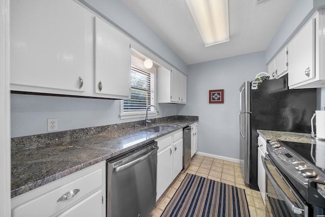 250 Grand Isle Dr Unit 5-A, Hot Springs, AR 71913 - kitchen with baseboards, white cabinets, a sink, and appliances with stainless steel finishes