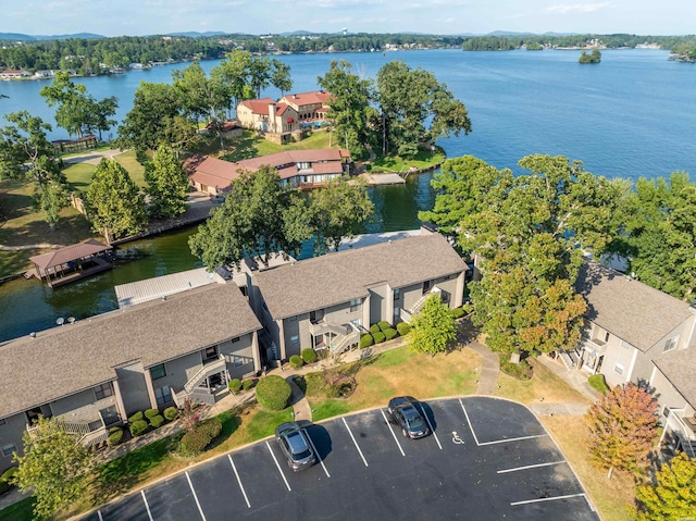 birds eye view of property with a water view and a residential view