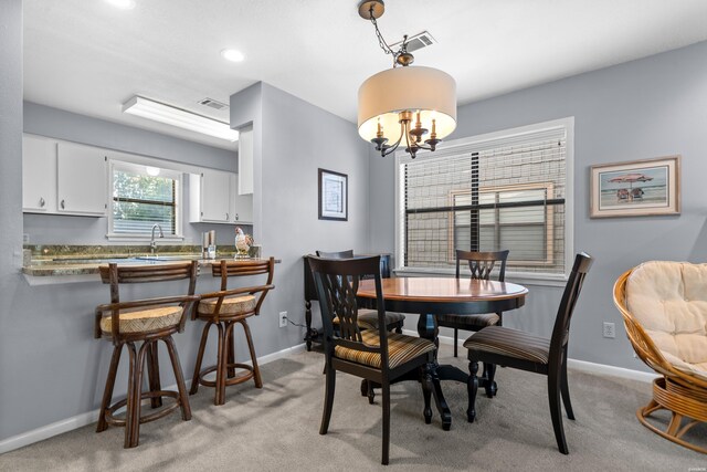 250 Grand Isle Dr Unit 5-A, Hot Springs, AR 71913 - dining area with light carpet, visible vents, and a chandelier
