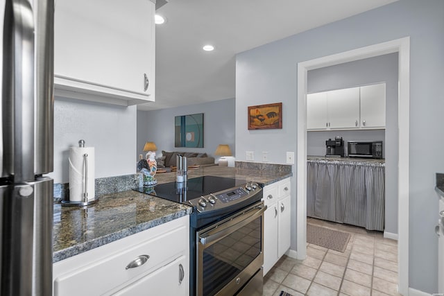250 Grand Isle Dr Unit 5-A, Hot Springs, AR 71913 - kitchen with light tile patterned flooring, stainless steel appliances, recessed lighting, dark stone countertops, and white cabinetry