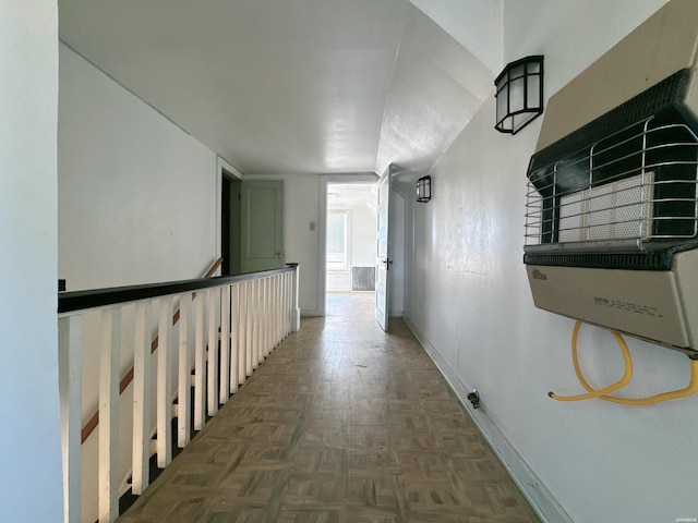 hallway featuring baseboards