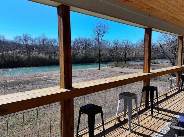 deck featuring a water view