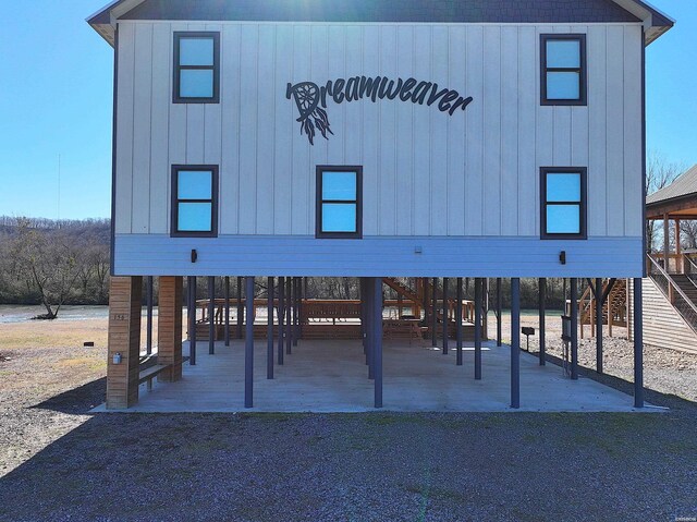 view of front of house with a carport and board and batten siding