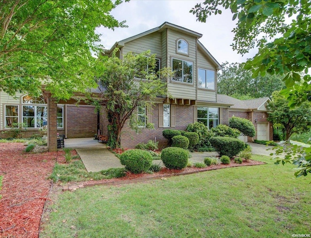 view of front of home with a garage, a front yard, and brick siding