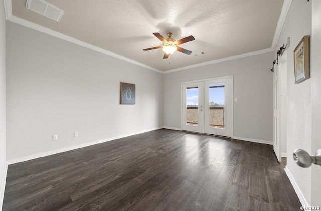 empty room with dark wood-style floors, visible vents, crown molding, and ceiling fan