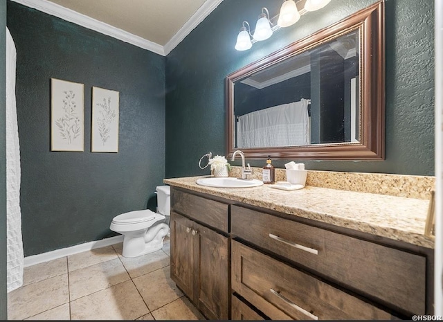 bathroom with tile patterned flooring, crown molding, baseboards, toilet, and vanity