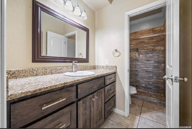 full bath featuring tile patterned flooring, toilet, vanity, and a shower stall