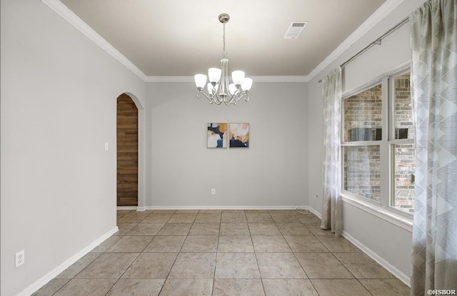 spare room with crown molding, plenty of natural light, arched walkways, and visible vents