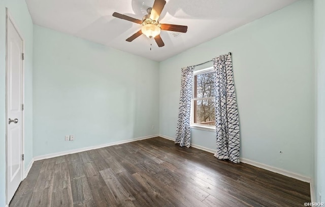 empty room featuring baseboards, ceiling fan, and wood finished floors