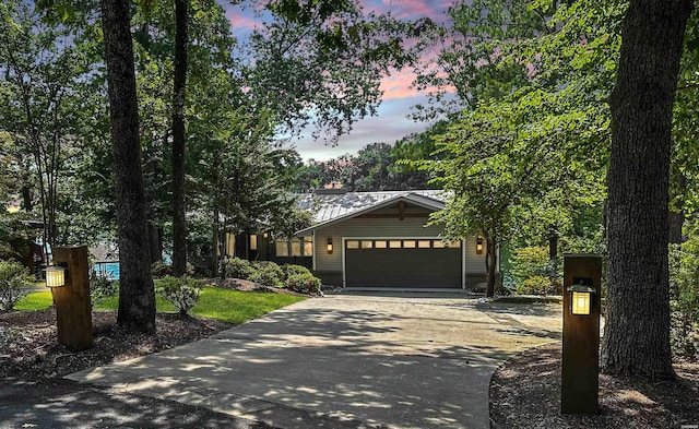 view of front of home with driveway and an attached garage