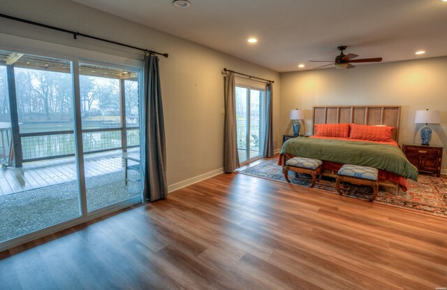 bedroom featuring baseboards, recessed lighting, wood finished floors, and access to exterior