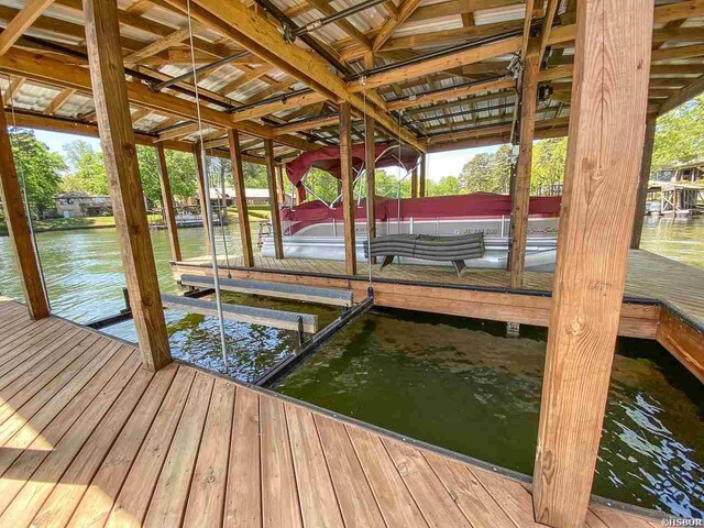 dock area featuring a water view and boat lift