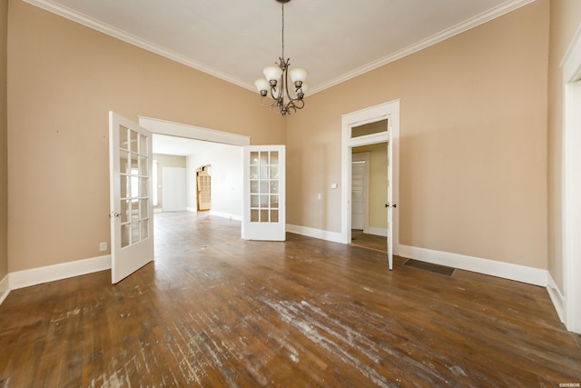 801 Crittenden St, Arkadelphia, AR 71923 - empty room featuring french doors, crown molding, a chandelier, baseboards, and hardwood / wood-style flooring