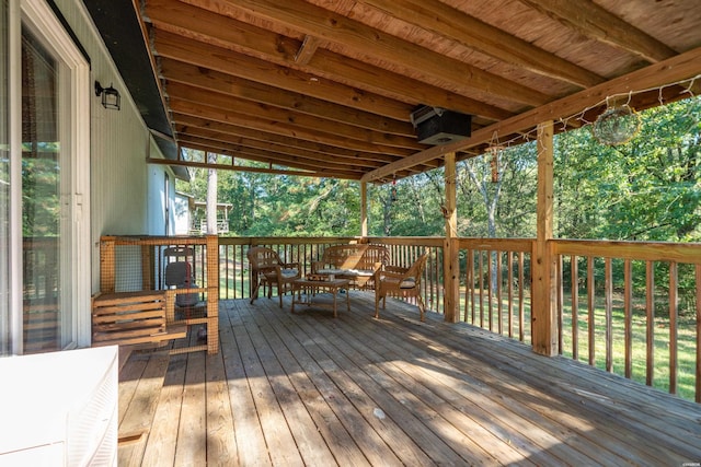 wooden deck featuring outdoor dining area