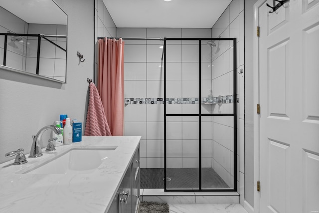 full bathroom with marble finish floor, vanity, and a shower stall