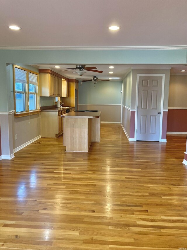 117 Waverly St, Hot Springs, AR 71913 - kitchen with baseboards, a ceiling fan, light wood-style floors, and crown molding