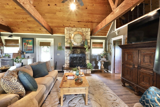living room with wood finished floors, a fireplace, ceiling fan, and wooden ceiling