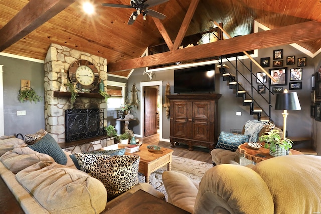 living room with a ceiling fan, wooden ceiling, stairway, and wood finished floors