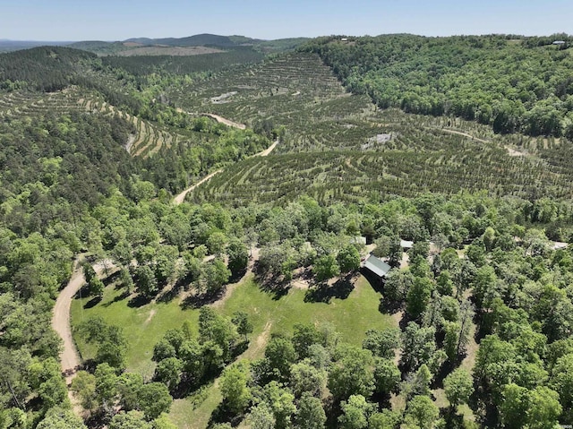 birds eye view of property with a view of trees