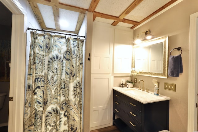 bathroom featuring vanity and a shower with curtain