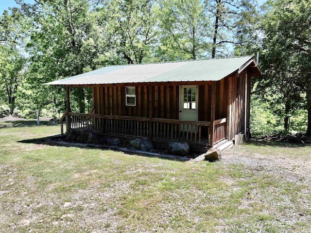 view of front of house with a porch and a front yard